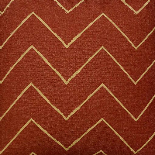 Scaled photo of 45cm x 45cm rust coloured mud cloth cushion cover with zigzag print