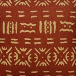 Image of rust coloured mud cloth cushion cover made of cotton linen fabric