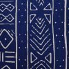 Close up of blue and white rectangular cushion cover with mud cloth design