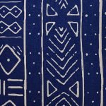 Close up of blue and white rectangular cushion cover with mud cloth design