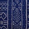 Close up image of navy blue mud cloth cushion cover with ethnic print