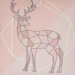 Close-up of pink cushion cover with geometric stag print