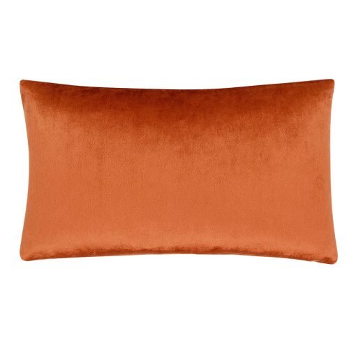 Photo of rust coloured rectangular cushion cover in rectangular shape