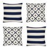 Image of 4 navy and white cushion covers in Hamptons design