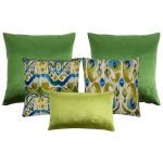 Photo of square and rectangular cushions in green, yellow green and teal colours