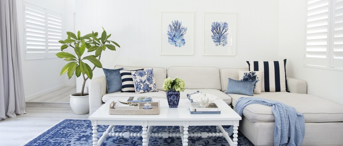 Stunning Hamptons inspired scene with blue and white decorations and hampton style cushions