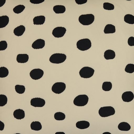 Photo of black and off white outdoor cushion cover with polka dot pattern