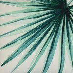 Close up image of 45cm x 45cm green and white outdoor cushion cover