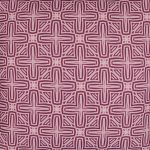 Close up photo of pink outdoor cushion cover with cross design