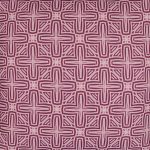 Close up photo of pink outdoor cushion cover with cross design