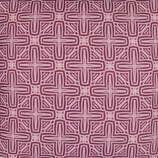 Close up photo of pink outdoor cushion cover with cross design