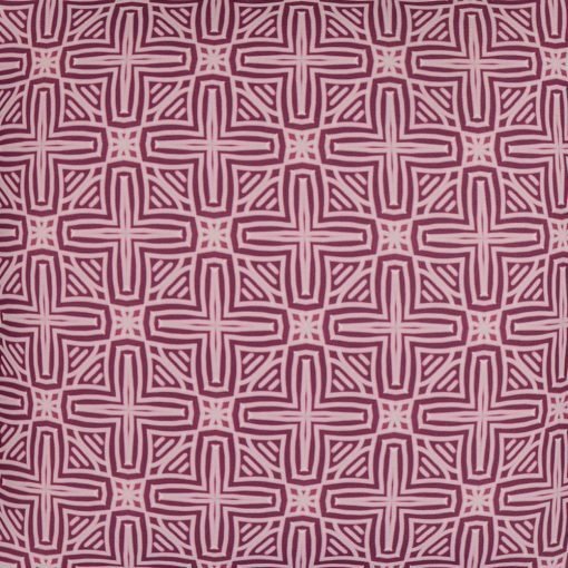 Close up photo of pink outdoor cushion cover with cross design