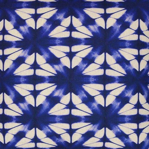 Close up of tie-dye inspired cushion in kaleidoscope patten