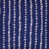 Close up image of navy blue cushion with stripes
