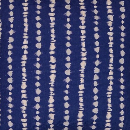 Close up image of navy blue cushion with stripes