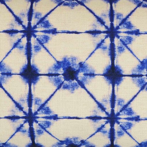 Close up image of rectangular kaleidoscope-inspired cushion in blue and white colours