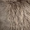 Close up of light tawny brown square cushion cover in fur fabric