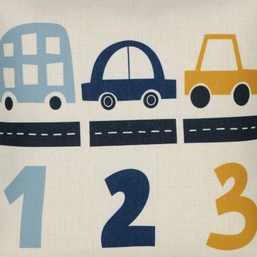 Close up photo of little boys cushion with blue and yellow cars