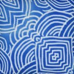 Close up image of mediterranean inspired blue outdoor cushion cover