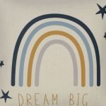 Close up photo of kids cushion cover with blue rainbow and dream big print