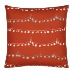Red Christmas cushion with strings of bells and baubles