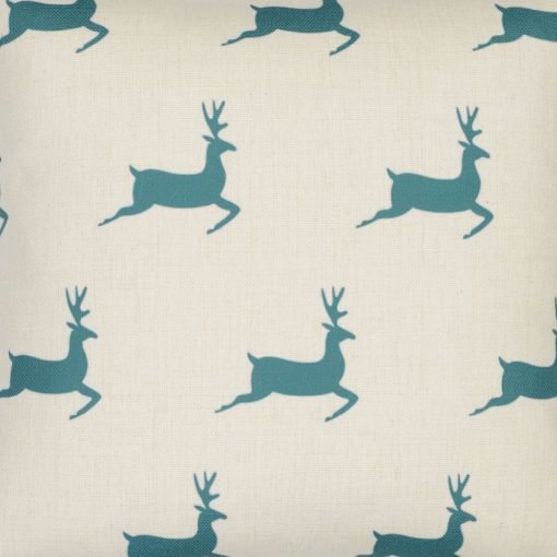 Close up image cotton linen blend cushion cover with teal-coloured stags