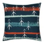 Red and teal square cushion with white pine trees