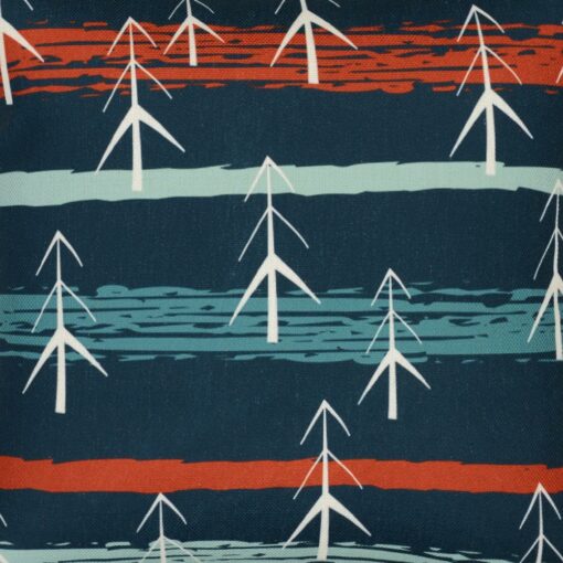 Close up photo of vibrant and teal cushion cover with pines and stripes