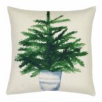 Photo of linen cushion cover with green fern plant