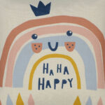 Close up of kids cushion cover with happy, pink rainbow