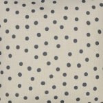 Close up image of kids cushion cover with plain polka dots