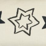 Close up photo of plain cotton linen cushion cover with three black stars