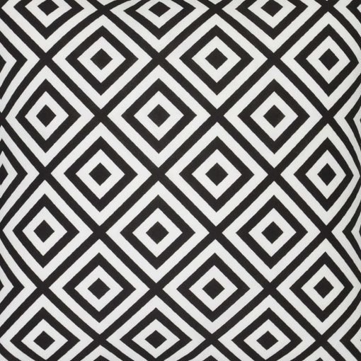 A close up view of a striking geometric pattern is shown on a black and white outdoor cushion cover.
