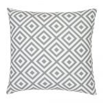 A striking geometric pattern is shown on a grey outdoor cushion cover.