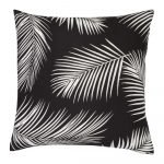 A repeating palm tree leaf print features on a waterproof black and white outdoor cushion cover.