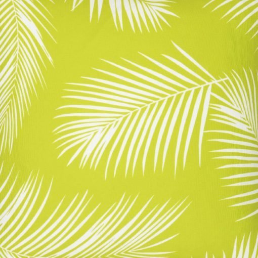 A close up view of a repeating palm tree leaf print features on a waterproof lime green outdoor cushion cover.