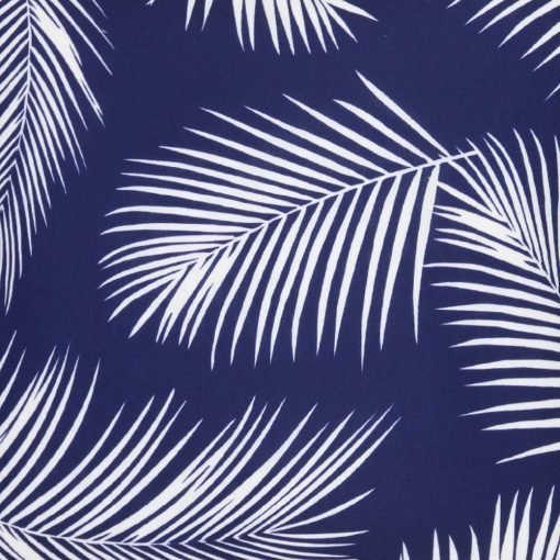 A close up view of repeating palm tree leaf print features on a waterproof navy blue outdoor cushion cover.