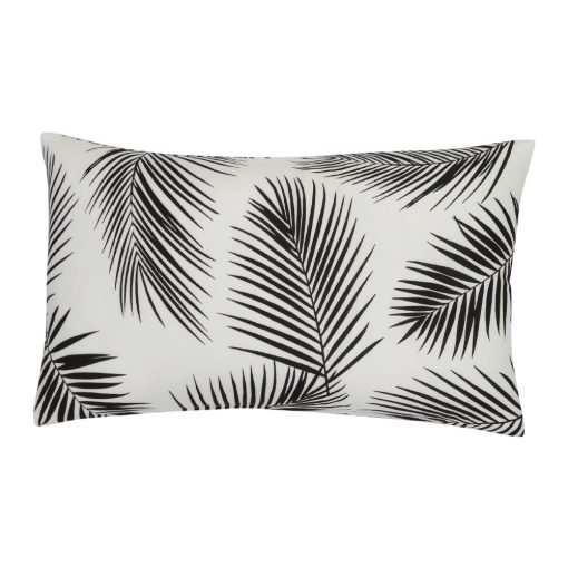 A rectangular black and white outdoor cushion with beautiful palm leaf pattern on both sides.