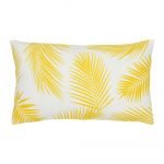 A rectangular yellow outdoor cushion with beautiful palm leaf pattern on both sides.