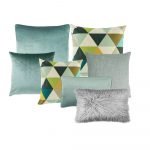 Photo of a seven set of cushion covers in grey and sage green.