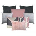 Vibrant cushion collection with rich pinks and subtle greys/ The large dark grey cushions provide an elegant backdrop for the light grey velvet cushions.