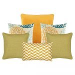 A set of 6 cushion covers is pictured with yellow and green colours and patterns.