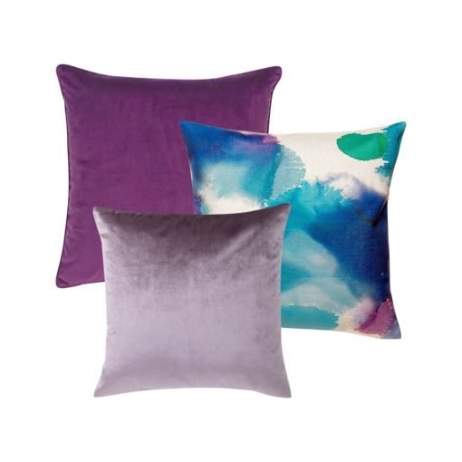 A set of 3 square cushions in plum purple and lilac colours