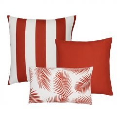 A collection of 3 red outdoor cushions featuring striped, plain and botanical designs.