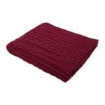 An image of a burgandy knitted throw blanket