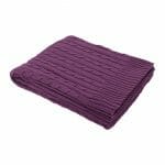 An image of a knitted purple throw blanket