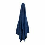 An image of a knitted throw blanket in royal blue colour