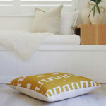 Cloth floor cushion cover in yellow brown colour with tribal print