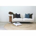 Blue and grey cushions made from 100% linen on a white sofa