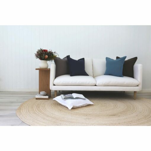 Blue and grey cushions made from 100% linen on a white sofa